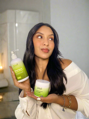 Woman holding a bottle and a jar of hair care product Bellahair 