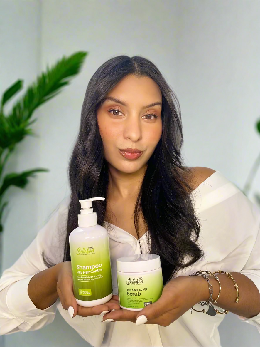 Woman holding two bottles of Bellahair products 